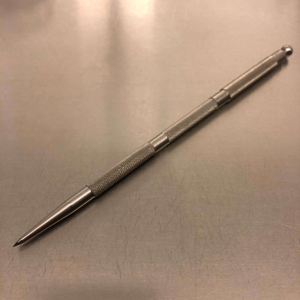 Stainless-steel pencil with tungsten carbide point and protective cap.