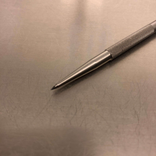 Tungsten carbide pencil for marking culture dishes.